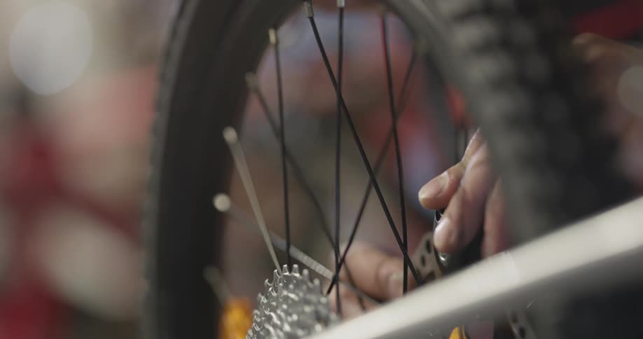 A person is working on a bike