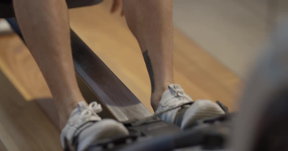 A man is working out using a machine