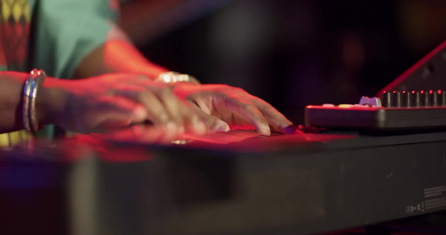 Keyboard and guitar are played on stage