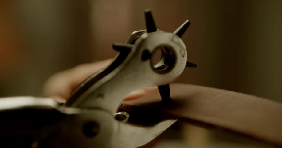 A tool is used to punch a hole