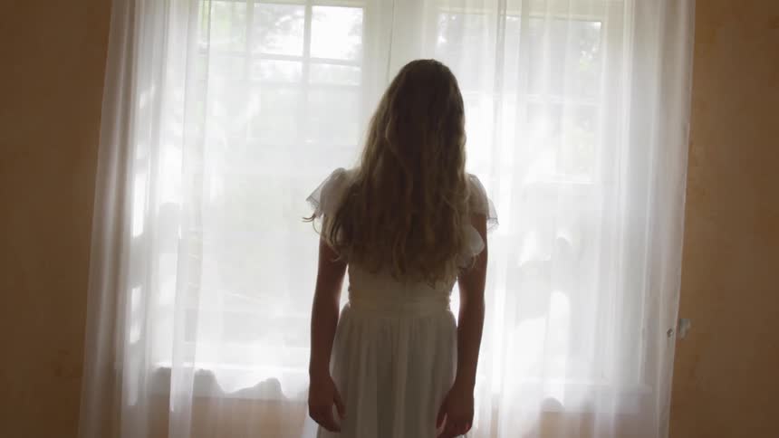 A woman with her hair in front of her face