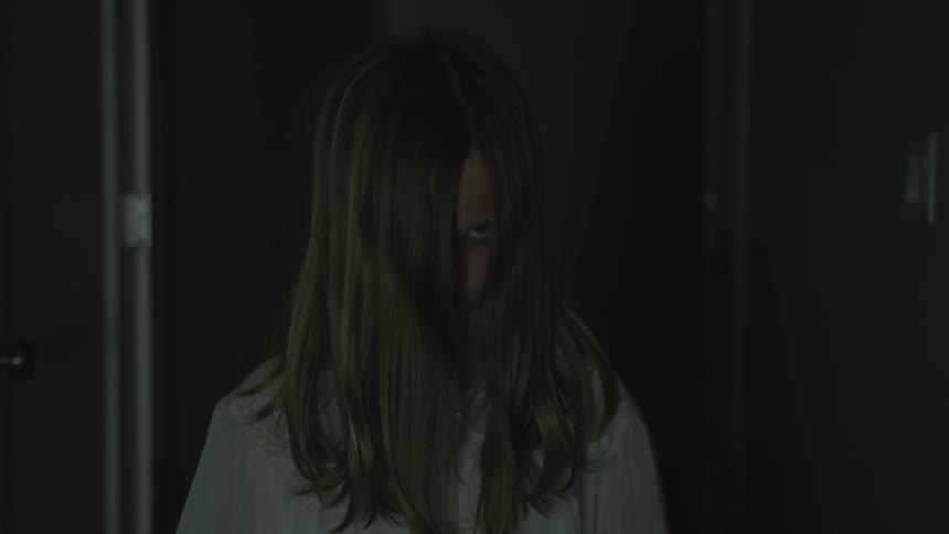 A woman with her hair over her face