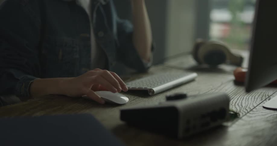Woman clicks away on a mouse