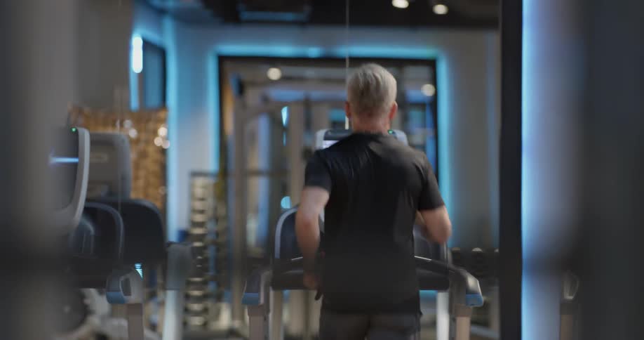 Man jogs on treadmill
