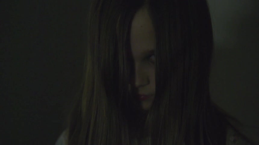 Young girl with hair covering her face