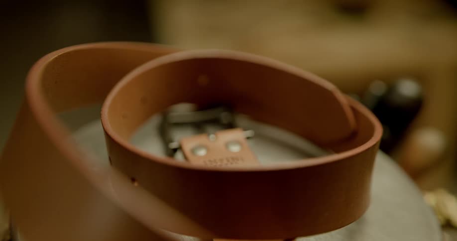 A leather belt sitting on a table