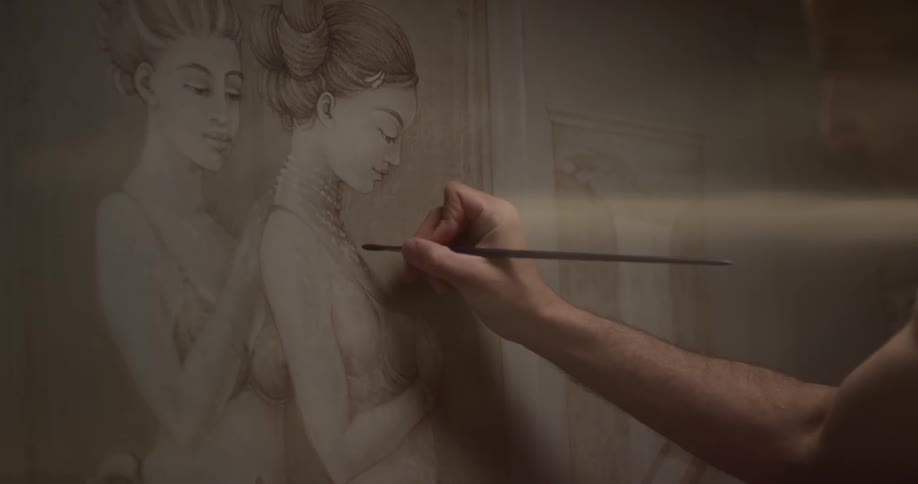 A man is drawing a picture of two women