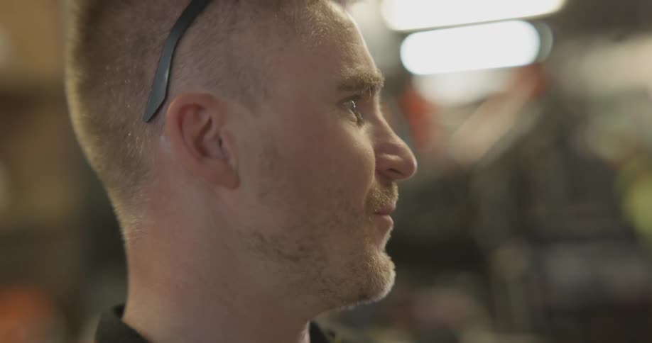 A man talks to someone to the left of him