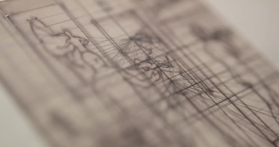 Close up of a drawing with a grid on top of it