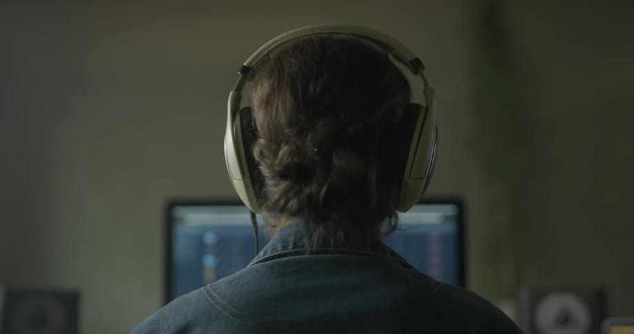 Woman puts on headphones