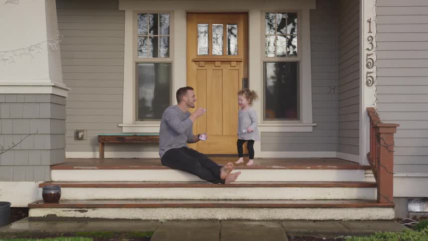 Father And Daughter Playing At Home