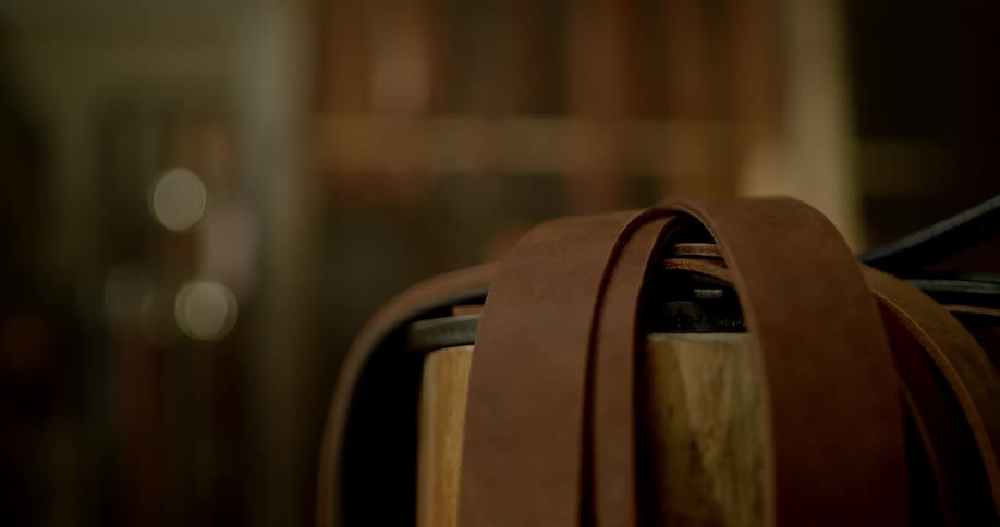 A leather belt is put onto a pile