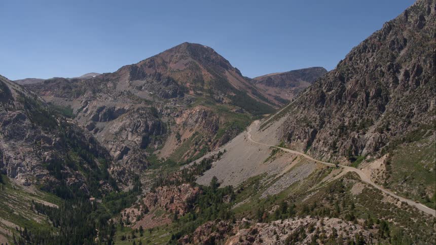 A road winding up a rocky mountain
