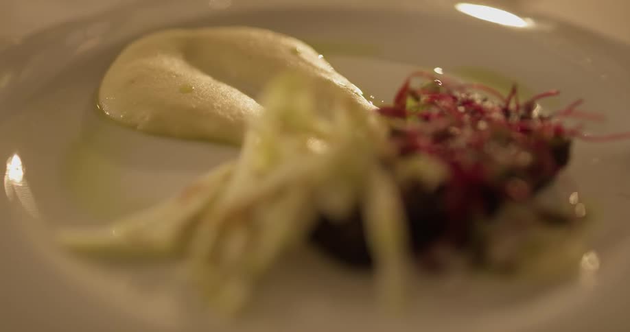 Three pieces of food on a white plate