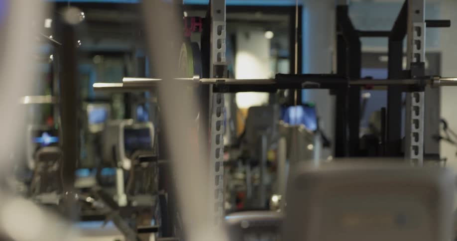 A man is walking around a gym