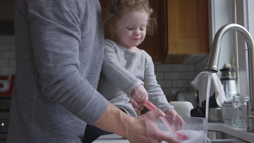 Father And Daughter Playing At Home