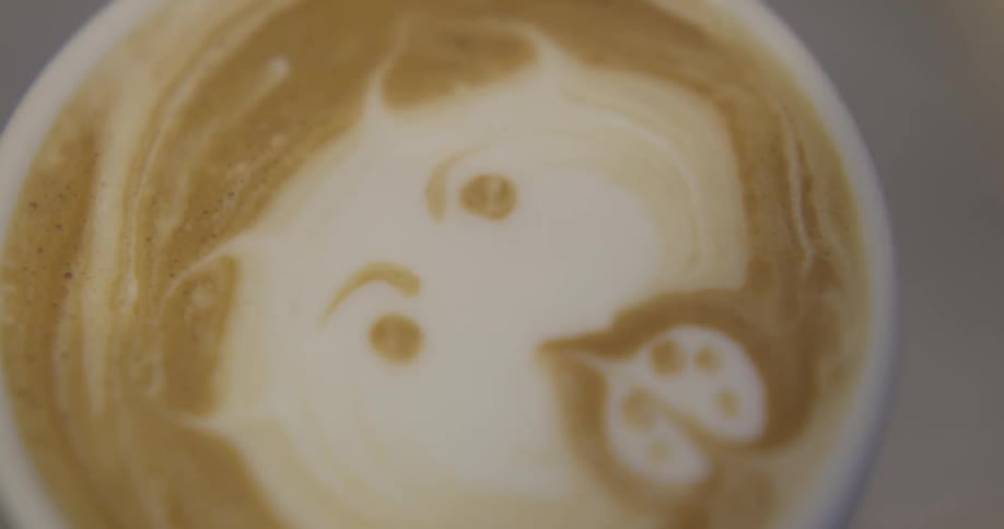 Woman Riding Bike To Coffee Shop