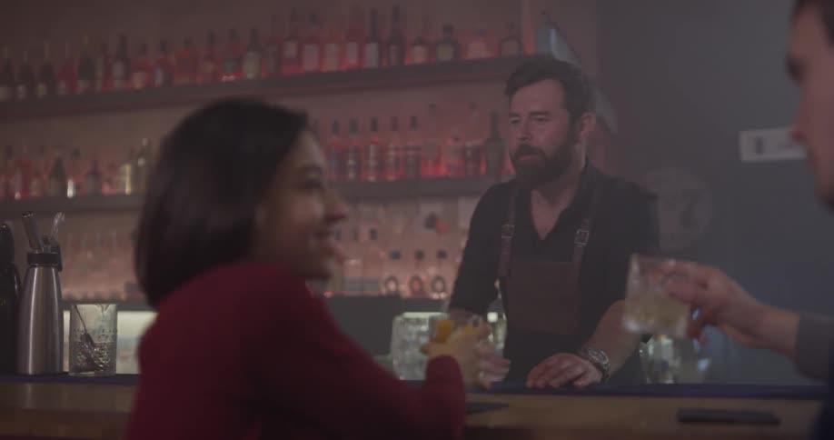 A woman and man are having drinks together