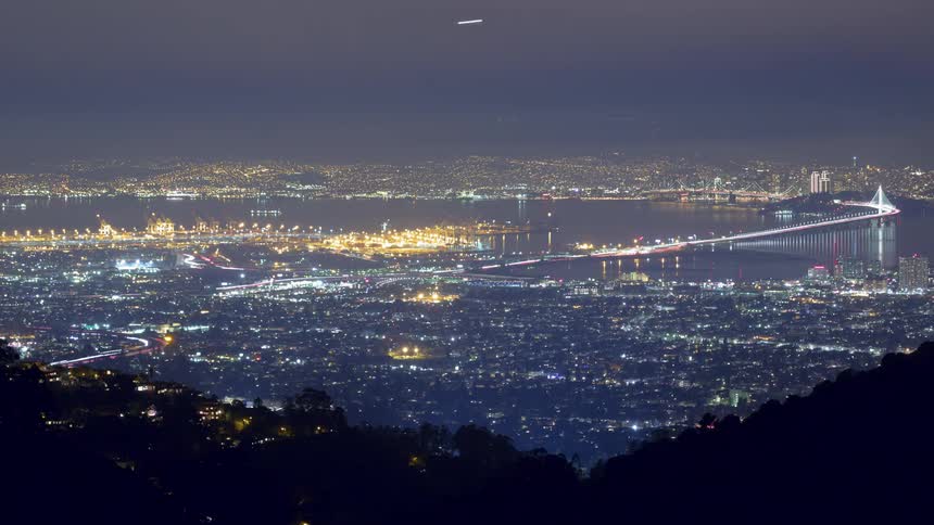 A busy city that is lit at night