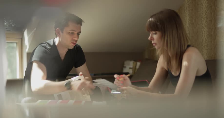 A woman is talking to a man who is listening