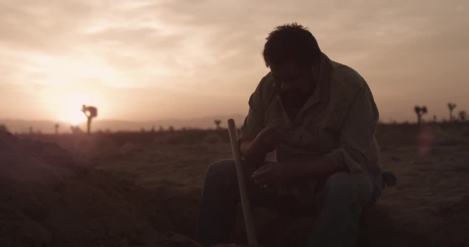 A person digging a hole
