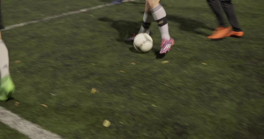 A group of people playing soccer
