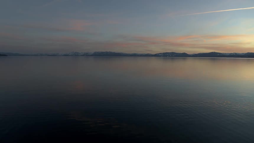 Sun is setting in the horizon over the ocean