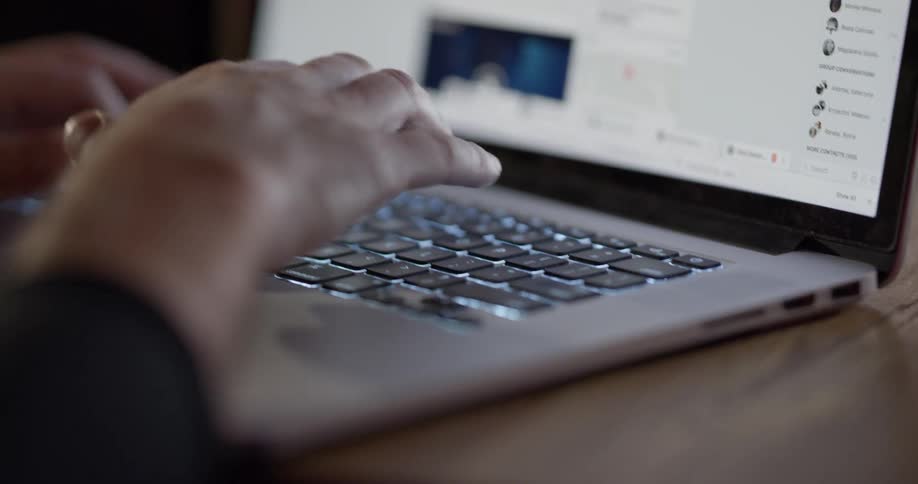 A person is scrolling with a touchpad and typing