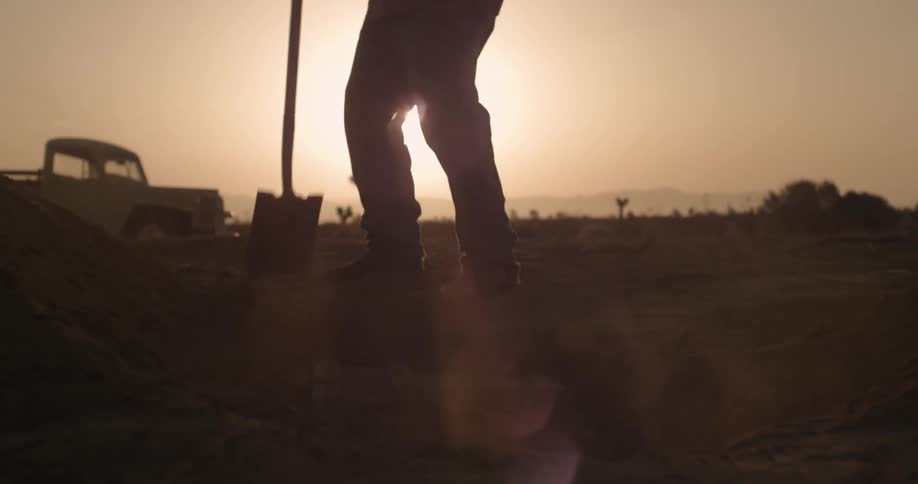 A person digging a hole
