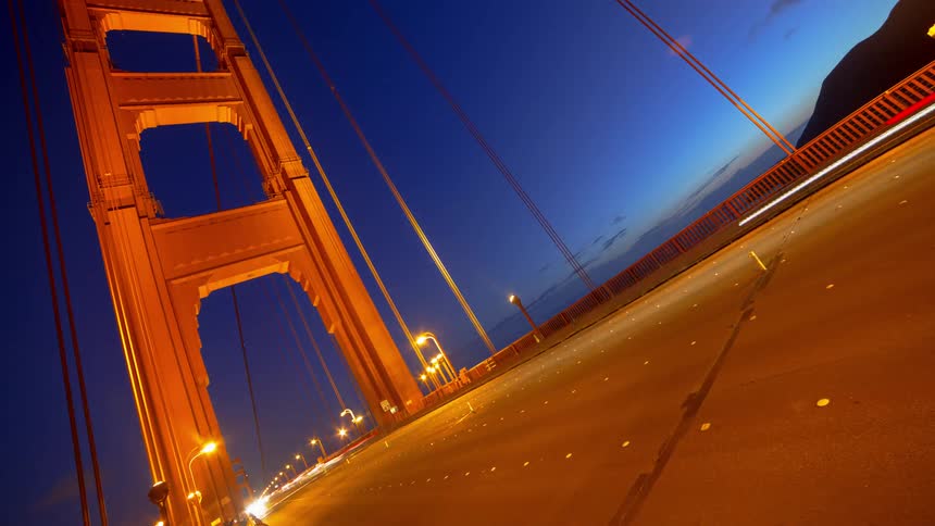 Cars are driving on the bridge