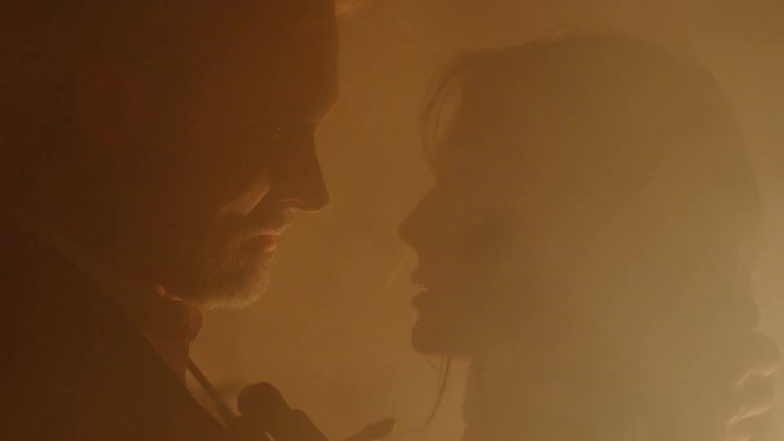 A man and woman staring into each other's eyes