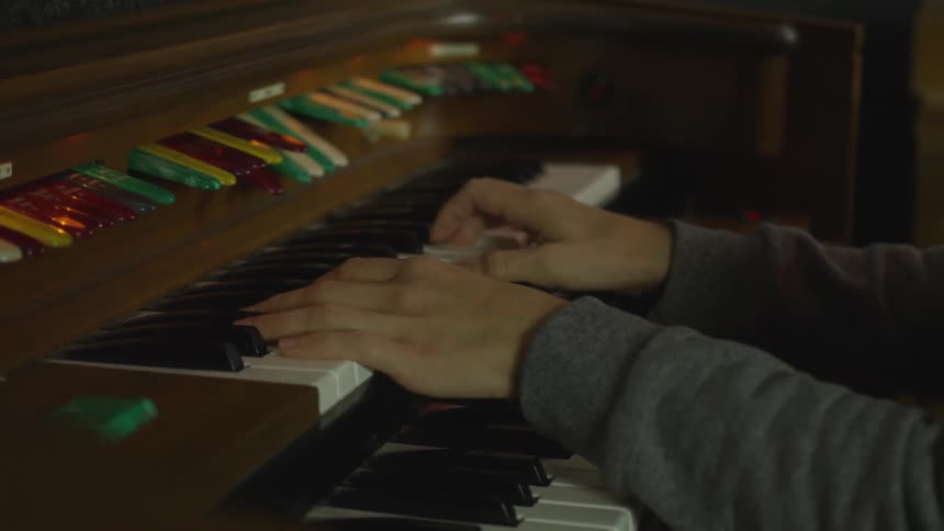 Man plays an organ