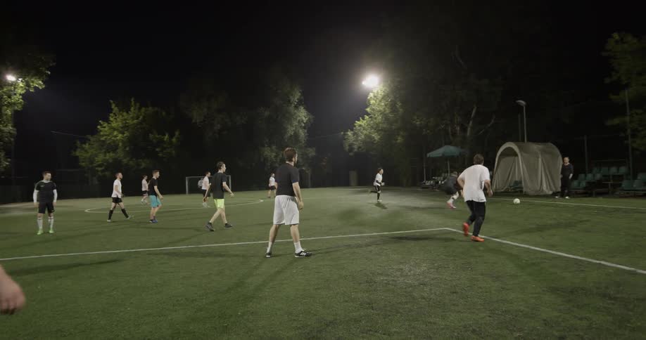 A group of men playing soccer together
