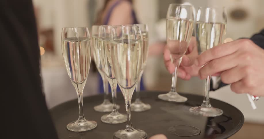 Server holding a tray of champagne