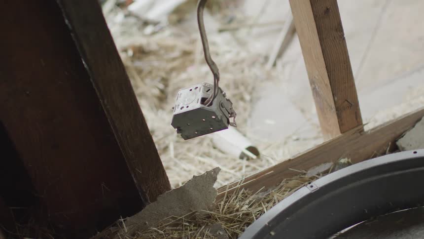 A piece of electronic hanging by the cord