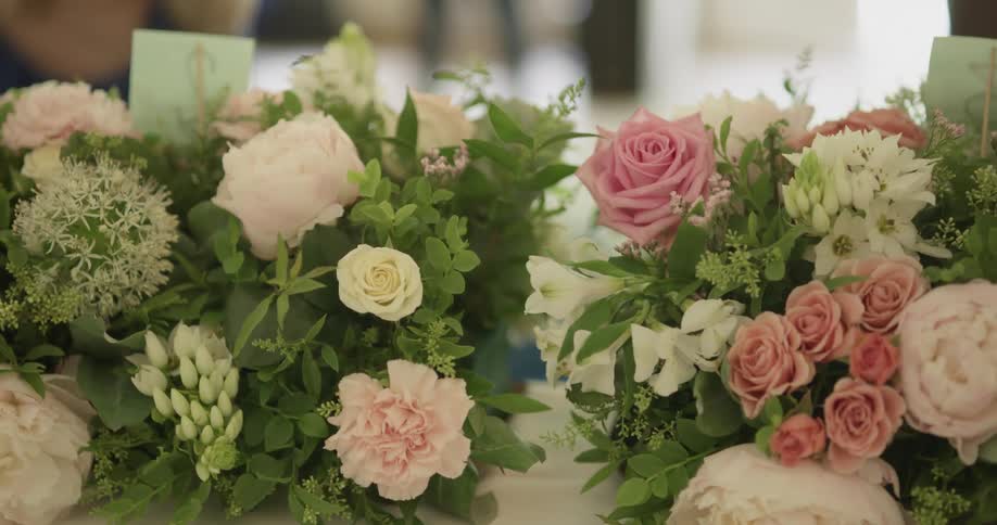 A woman is fixing the flowers