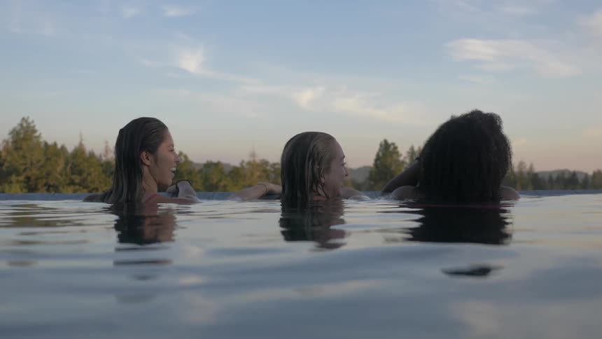 Friends Swimming Together