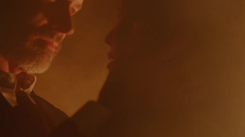 A man and a woman looking at each other in a plume of smoke