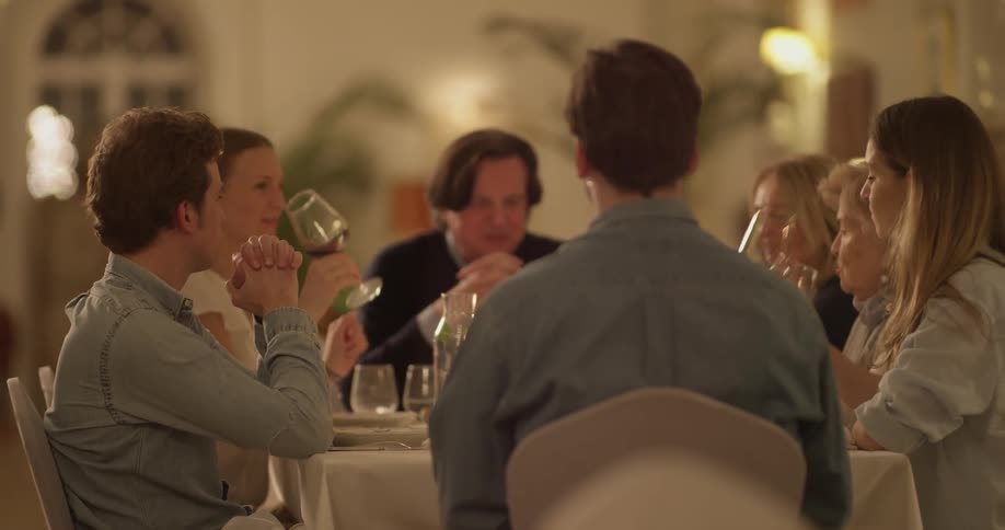 A group of people having dinner at a restaurant