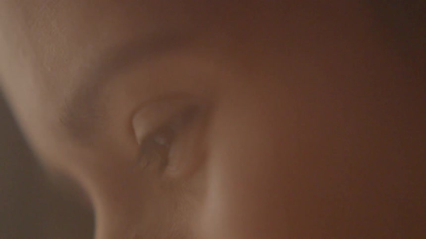 Women stares downwards smiling