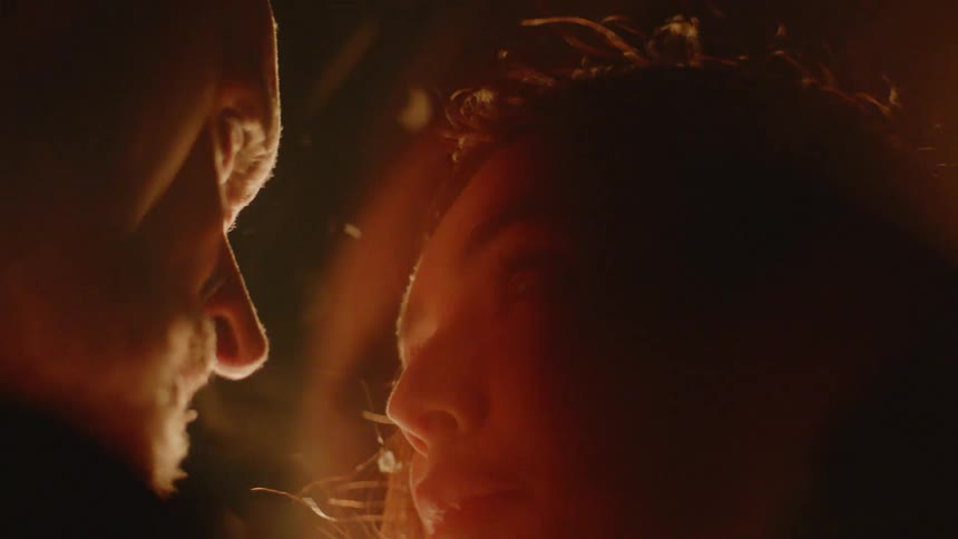 Couple Kissing By Fire In Desert