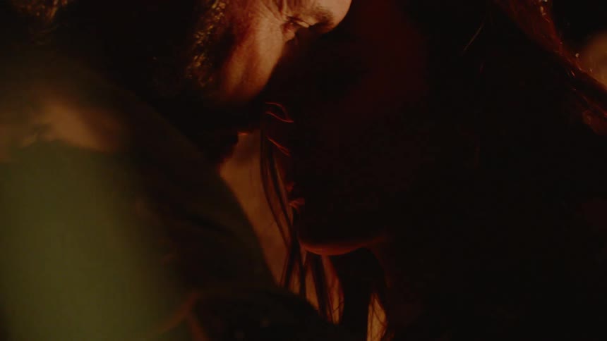 A man and woman are kissing