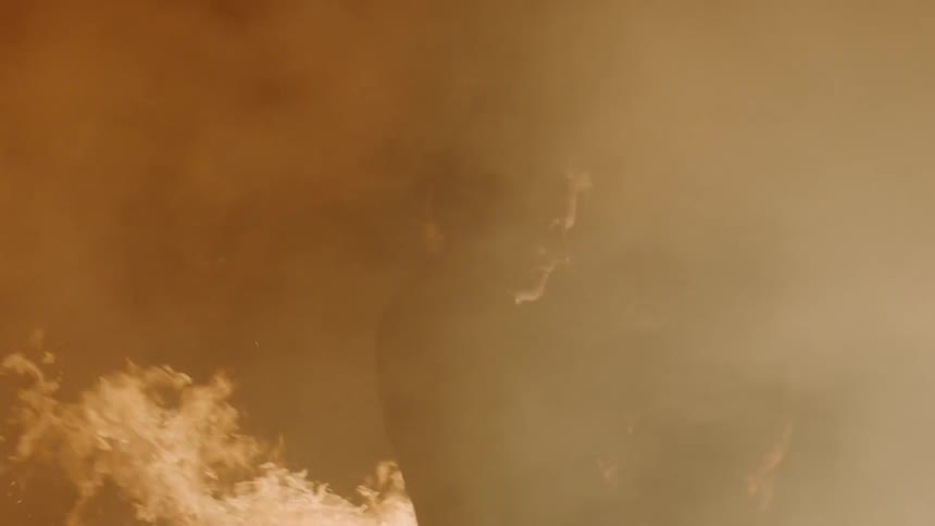 Couple Kissing By Fire In Desert