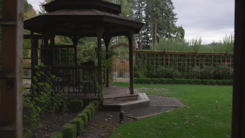 Gazebo in a formally landscaped backyard