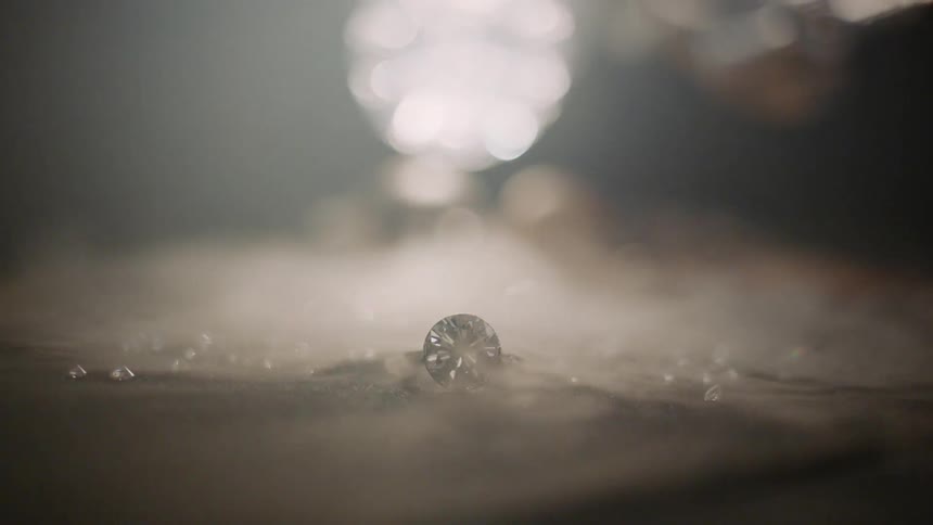 A diamond ring with fog rolling over it