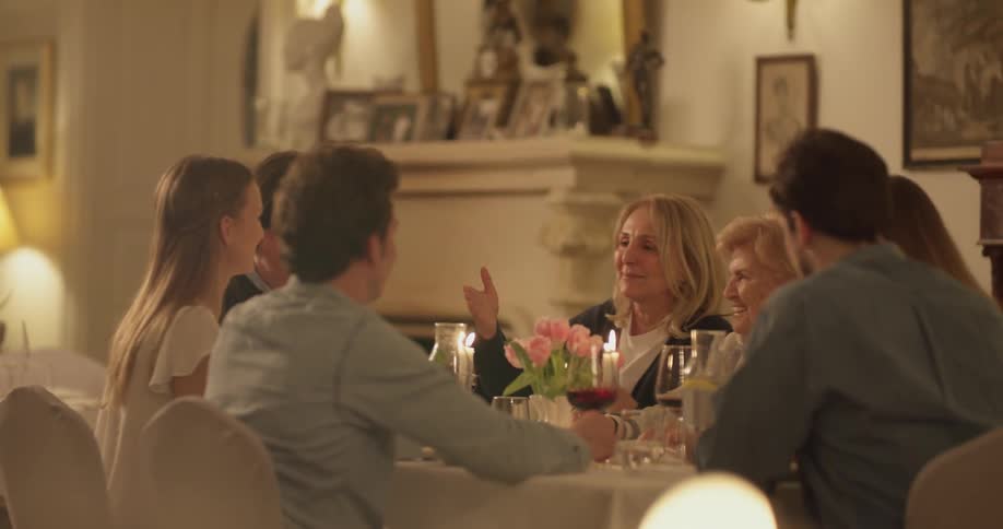 People are gathered around a table and talking