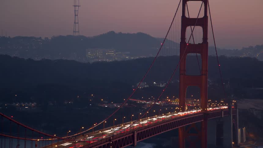 People are driving cars over the bridge