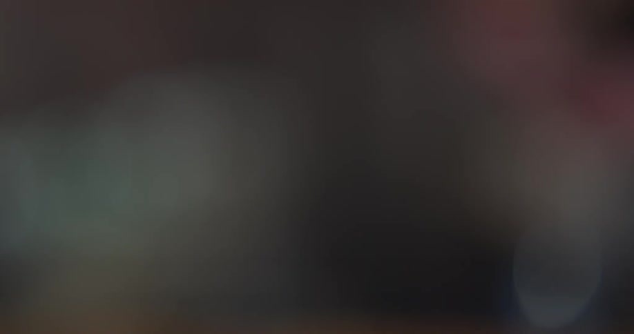 A person is grabbing a glass
