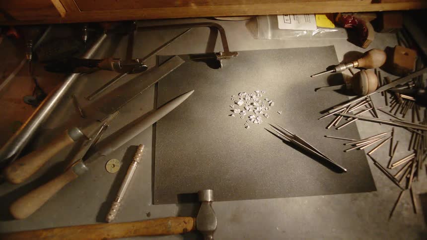Tools sitting on a workbench in a shop