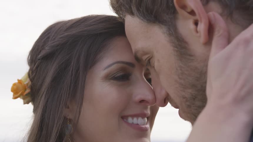 A man and woman embracing each other outdoors